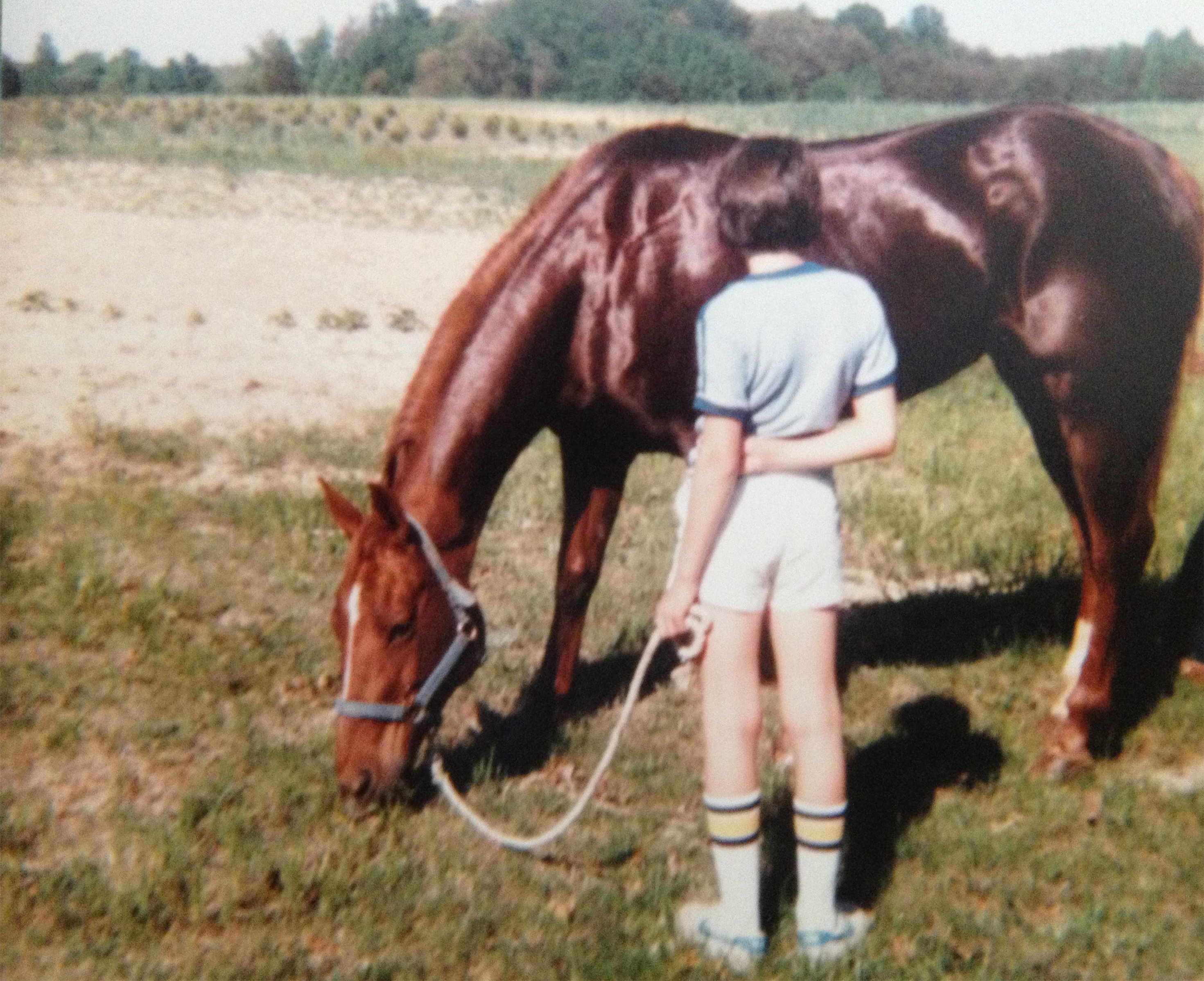 A young Tony on the farm facing the pine seedlings he helped plant